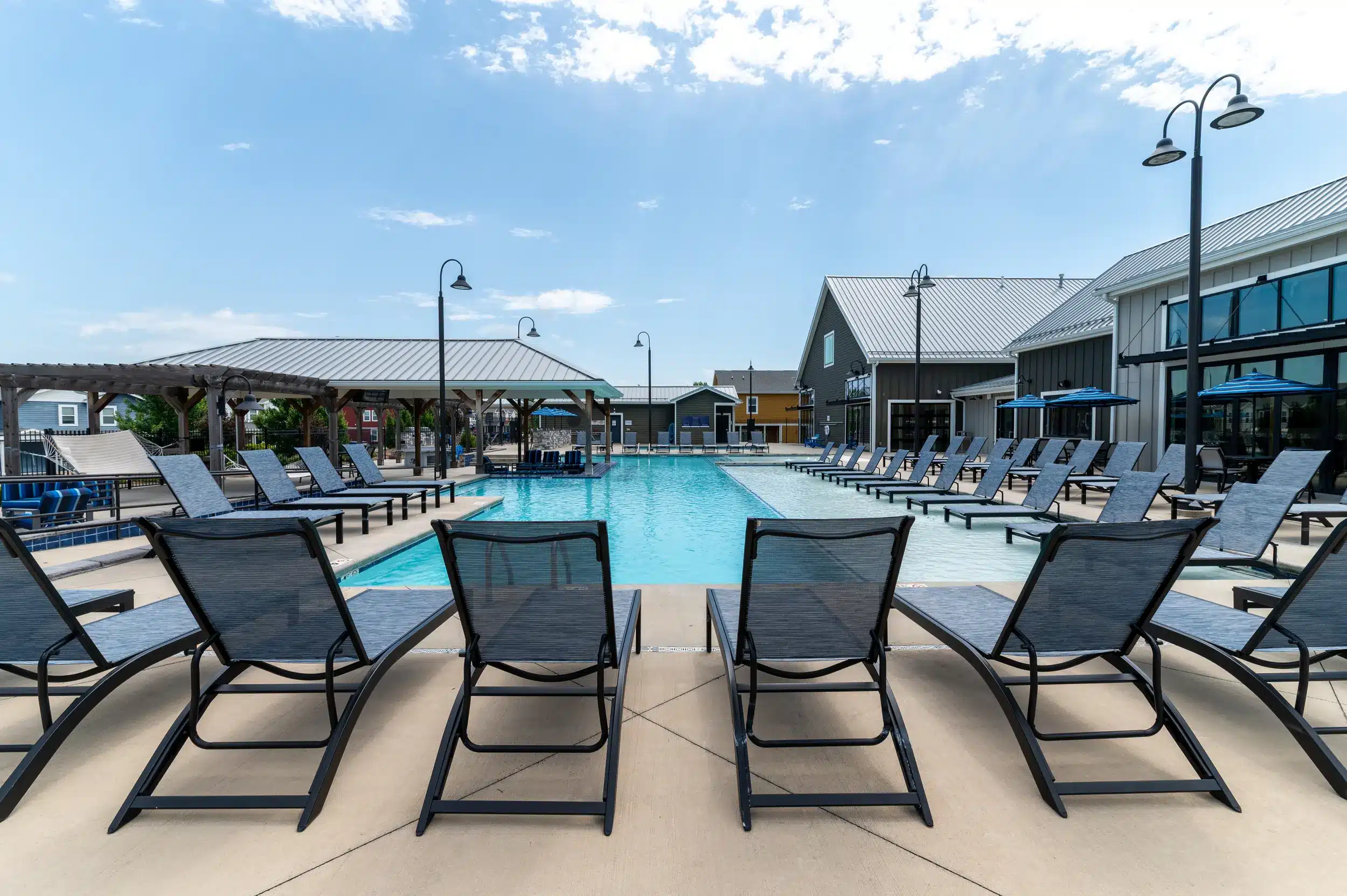 resort style pool lounge seating the collective at lawrence apartments near ku